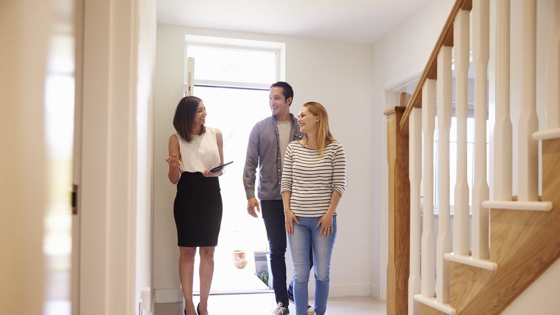 Couple looking at a house.