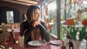 woman sitting at a table