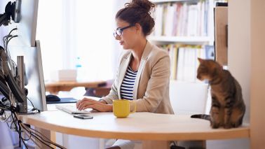 Woman who found flexible work at home on a computer