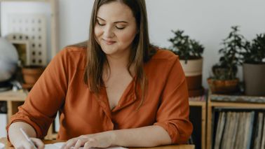 woman working on her new year's financial checklist