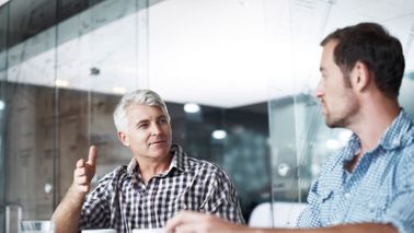 Coworkers talking about things you should know before co-signing for a child