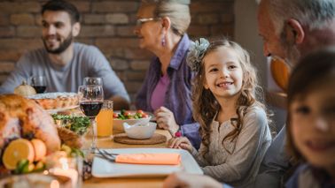 family gathered around thanksgiving table