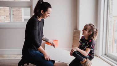 mother and daughter working on home maintenance project together