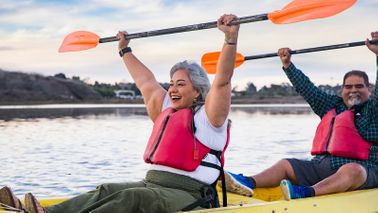 senior couple kayaking in retirement 