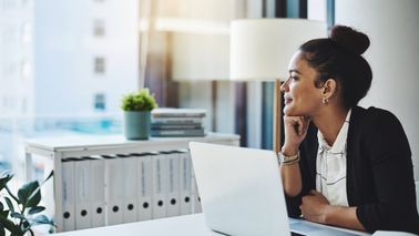 Woman reading Northwestern Mutual’s Weekly Market Commentary