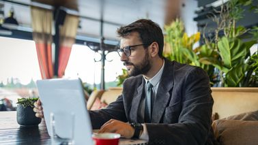 Man reading Northwestern Mutual’s weekly market commentary.