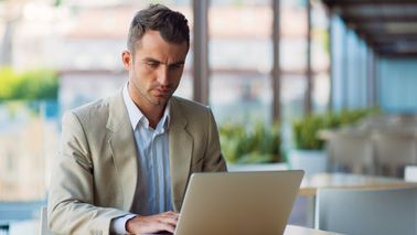 Man reading Northwestern Mutual’s Weekly Market Commentary.