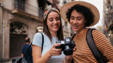 young-women-friends-upping-money-game-on-vacation