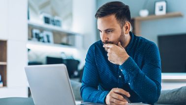 Man reading article from Northwestern Mutual about the importance of staying invested.