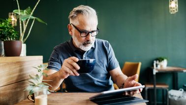   Man reading Northwestern Mutual Market Commentary