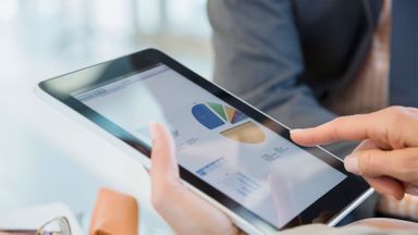 Person on a tablet learning what a 401k account can do