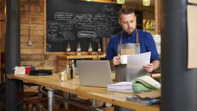 Small business owner reviewing Paycheck Protection Program