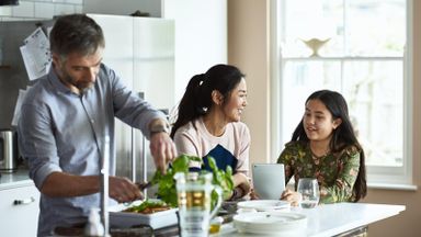 Family in the kitchen discussing whether they need an estate plan.