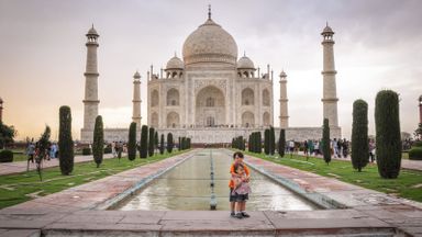 Kids on a trip around the world by the Taj Mahal