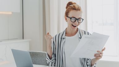 Woman at a desk researching 2025 tax brackets and how tax brackets work