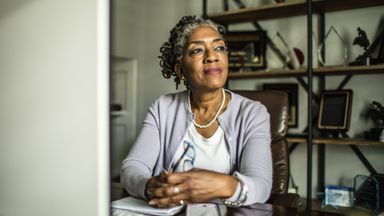 Woman contemplating the role of a trustee and whether she should select an individual or corporate trustee as a part of her estate plan.