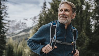 man in hiking in early retirement