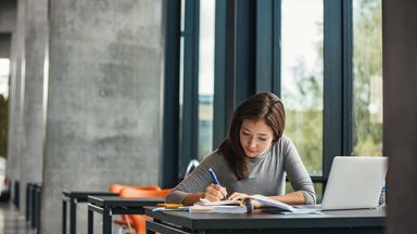 Woman studying in library