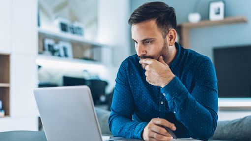 Man reading article from Northwestern Mutual about the importance of staying invested.