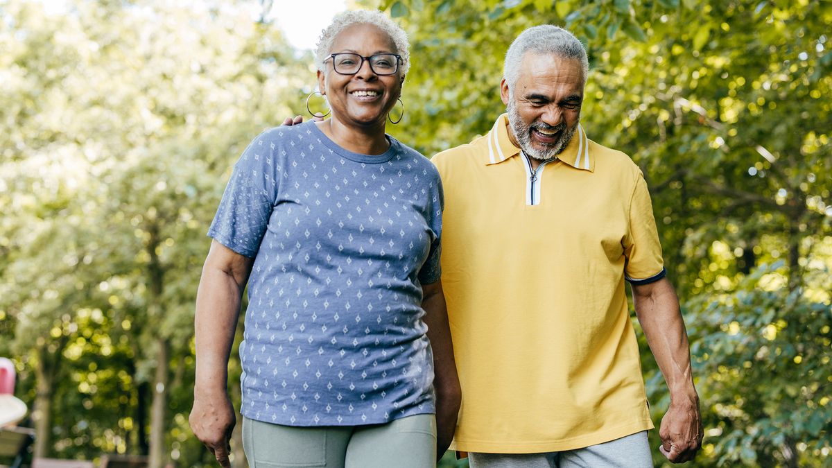 retired-couple-walking-in-park